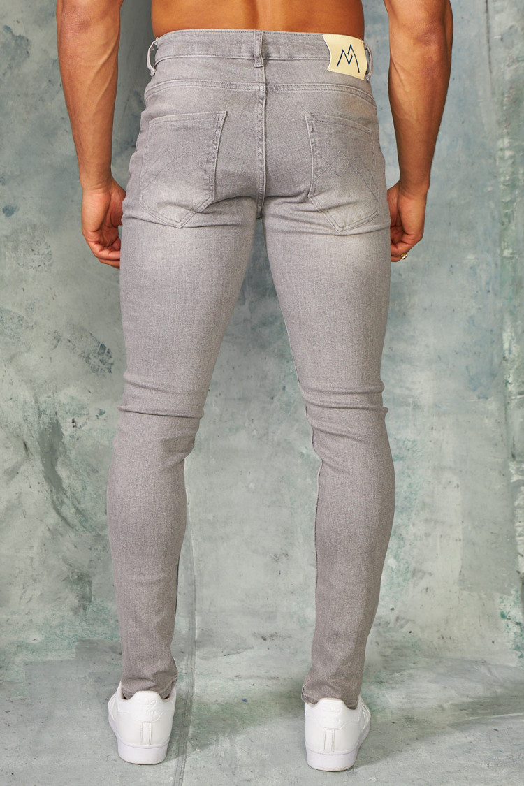 Jeans slim gris griffé