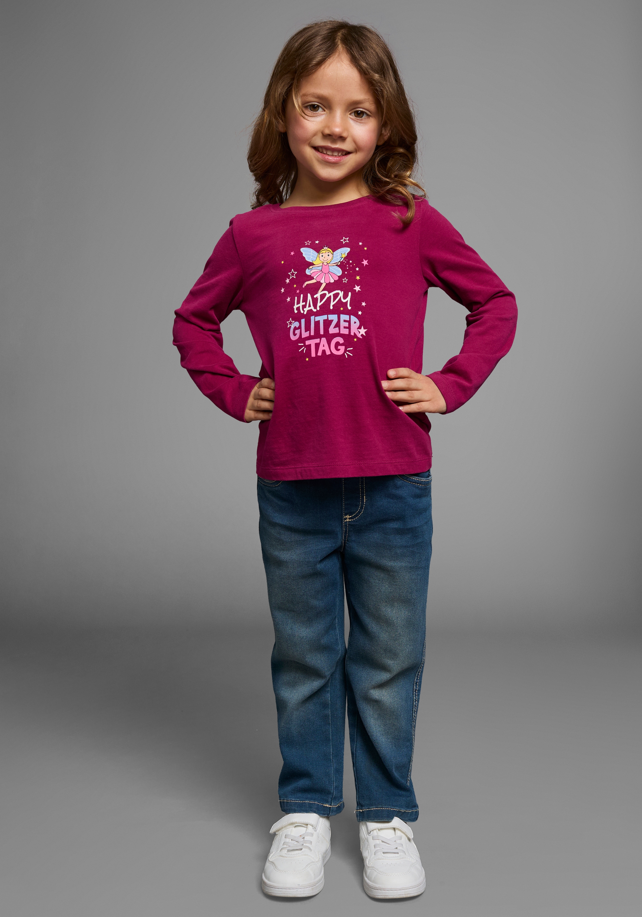 KIDSWORLD Langarmshirt »Mit Spruch: Happy Glitzer Tag« Langarm,  hüftlange Passform,  Rundhalsausschnitt