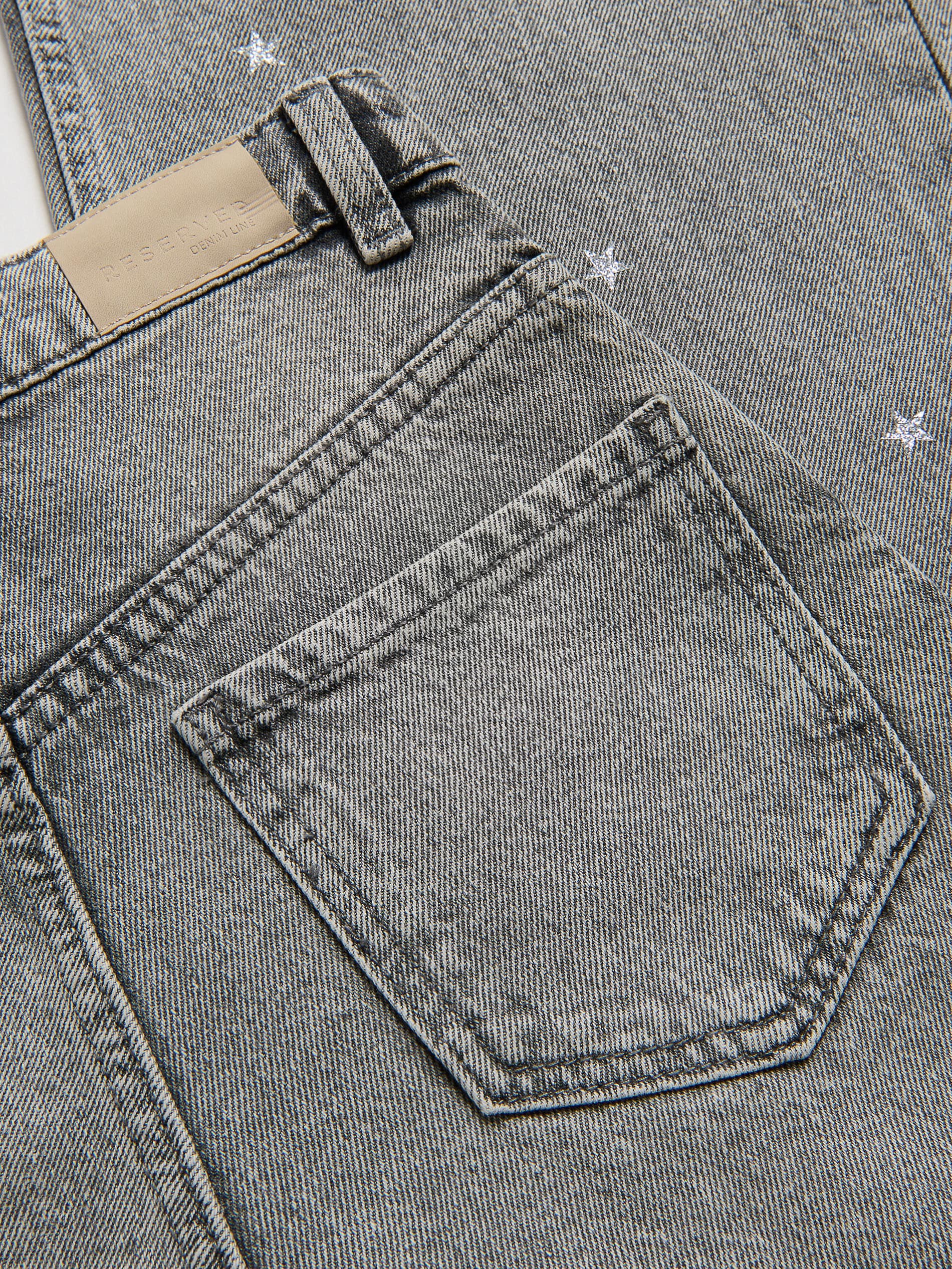 Wide‑Leg Jeans mit Sternen