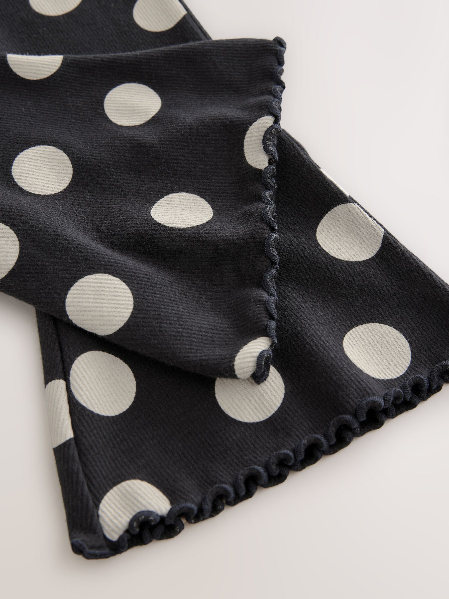 Zwart-wit gestippeld - Geribbelde flare legging (3 mnd-7 jr)