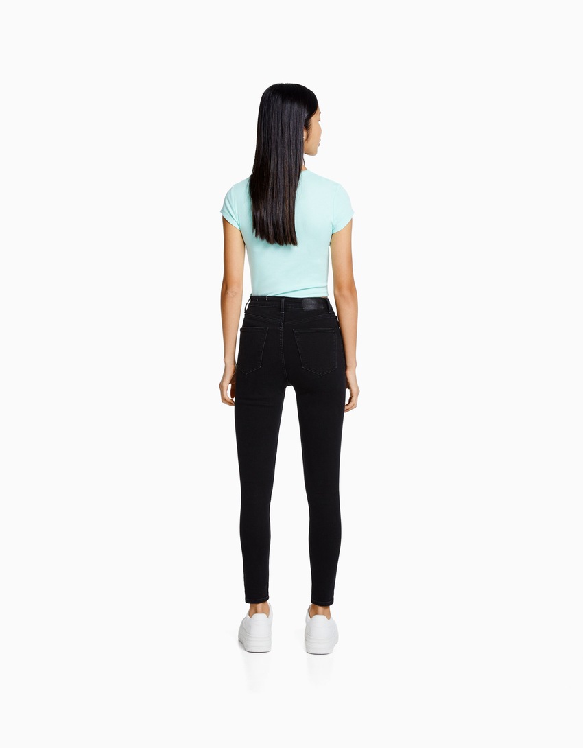 calça jeans skinny de cintura super alta