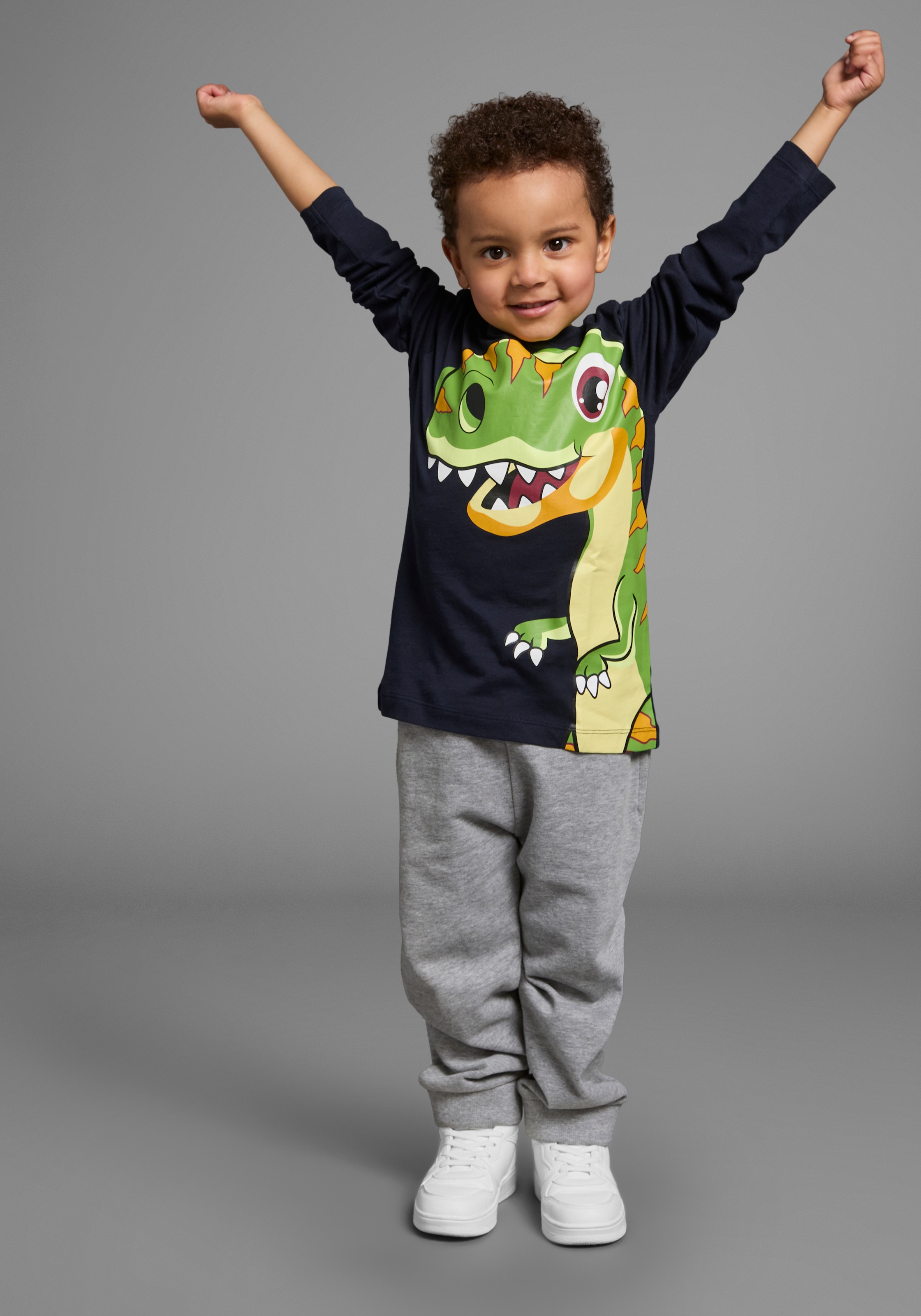 KIDSWORLD Langarmshirt »CURIOUS DINO«, Langarm,  Basic-Passform,  peppiger Druck