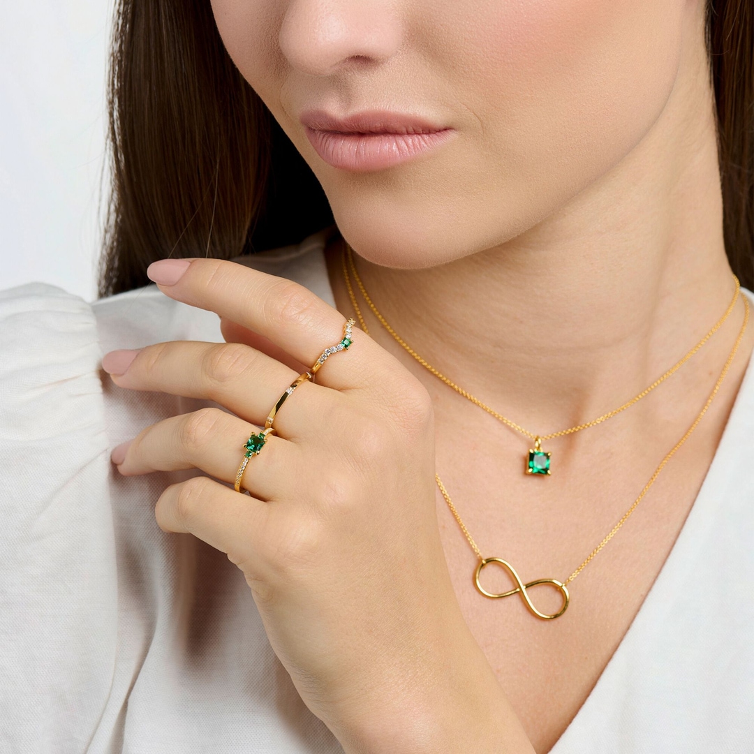 Thomas Sabo Ring mit grünen und weissen Steinen gold