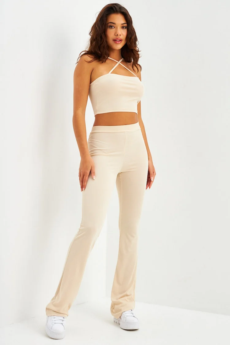 Ensemble crop top à bretelles + pantalon évasé côtelé écru