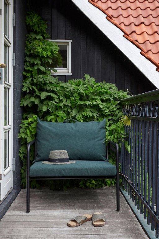 Houe Avon Lounge fauteuil frame zwart stof leaf heritage