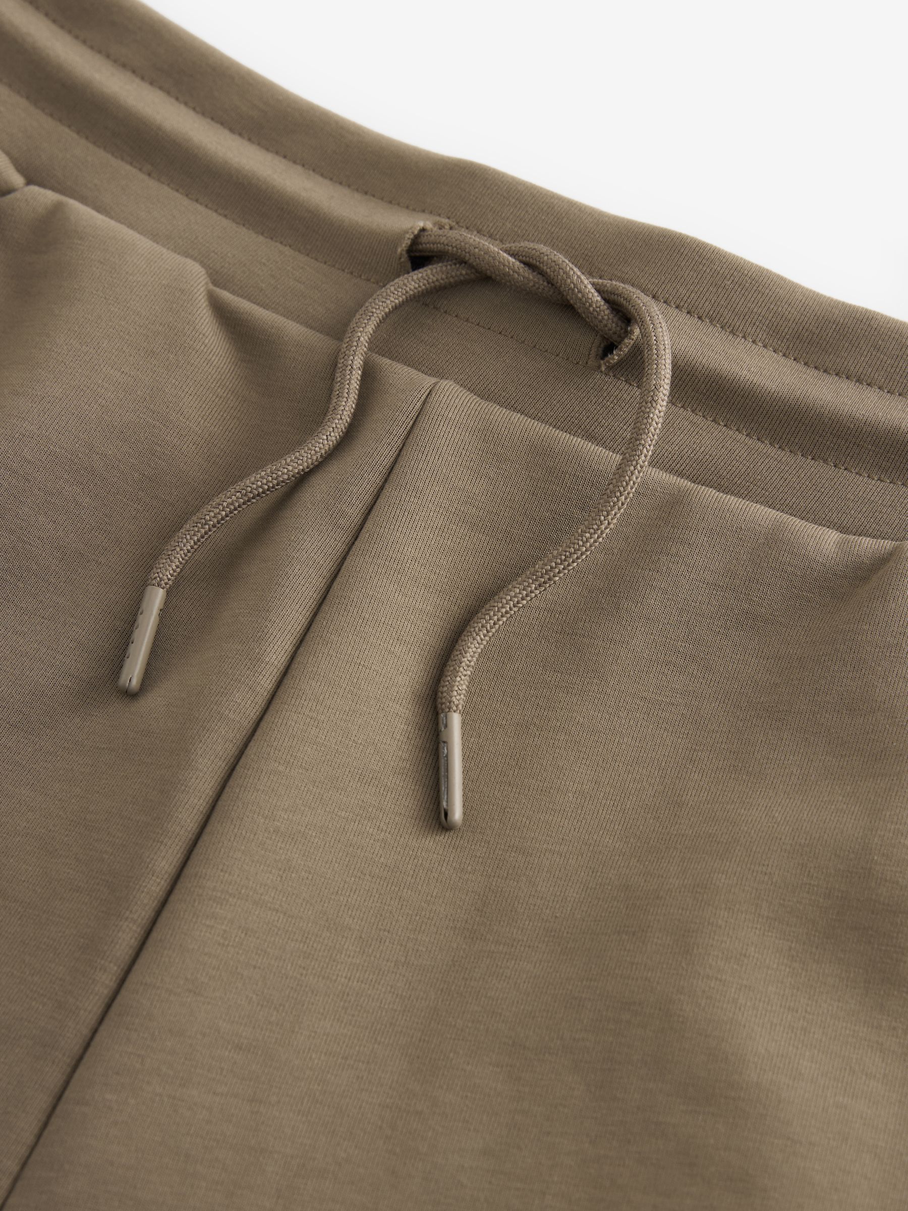 Donker kiezelkleurig - Jersey shorts met ritszakje
