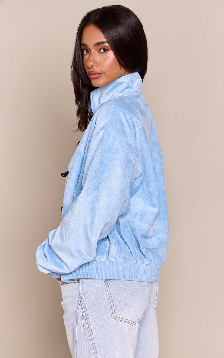 Bleu Layette Veste Bomber Petite En Synthétique À Col Montant Et Fermeture Éclair Frontale Avec Détails À Bascule