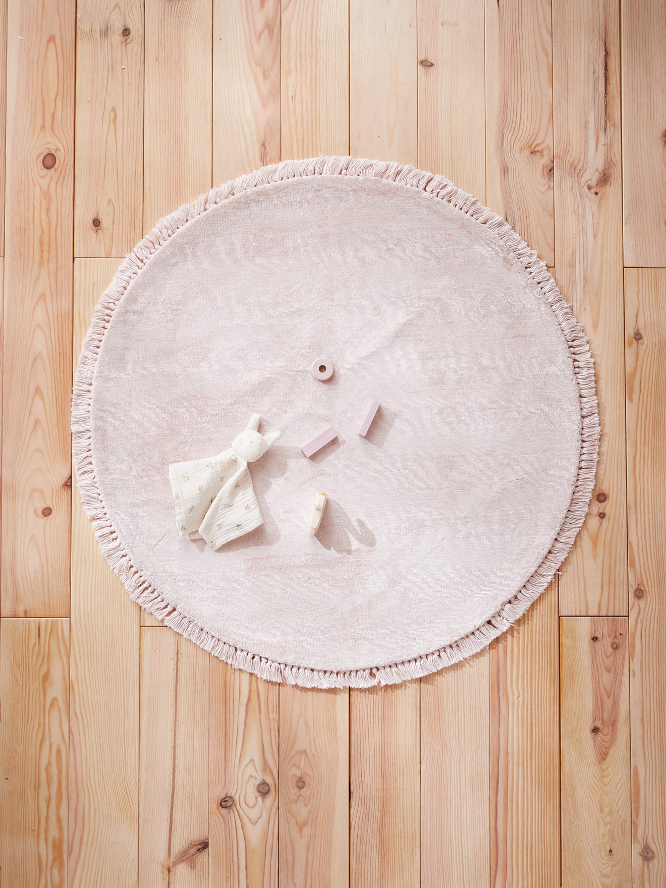 Tapis rond frangé