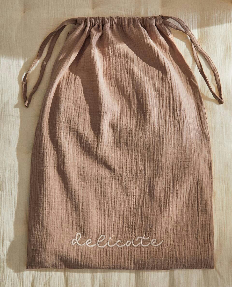 SACO DE ROUPA GRANDE COM ESTAMPA DE ESTRELA
