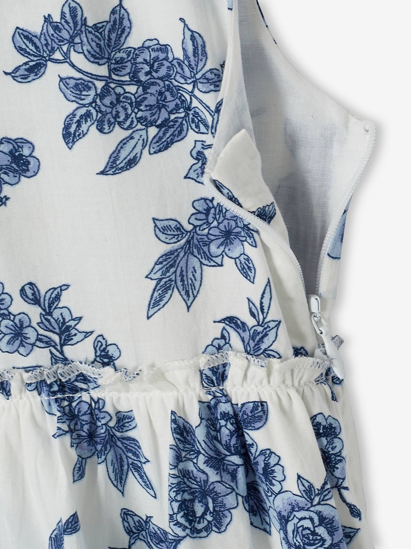Vestido de festa infantil com flores e laço nas costas, na cor branco-creme.