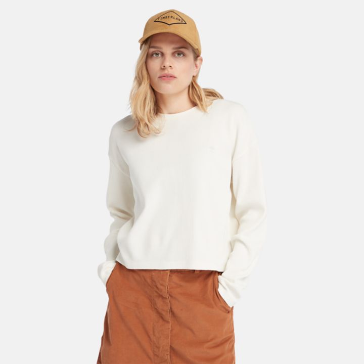 Camiseta feminina de manga comprida com textura waffle na cor branca.