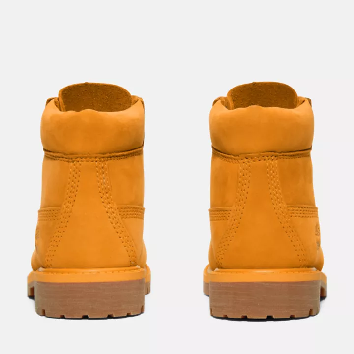 Bota Timberland Premium de 6 polegadas impermeável, edição 50, para jovens, na cor laranja.