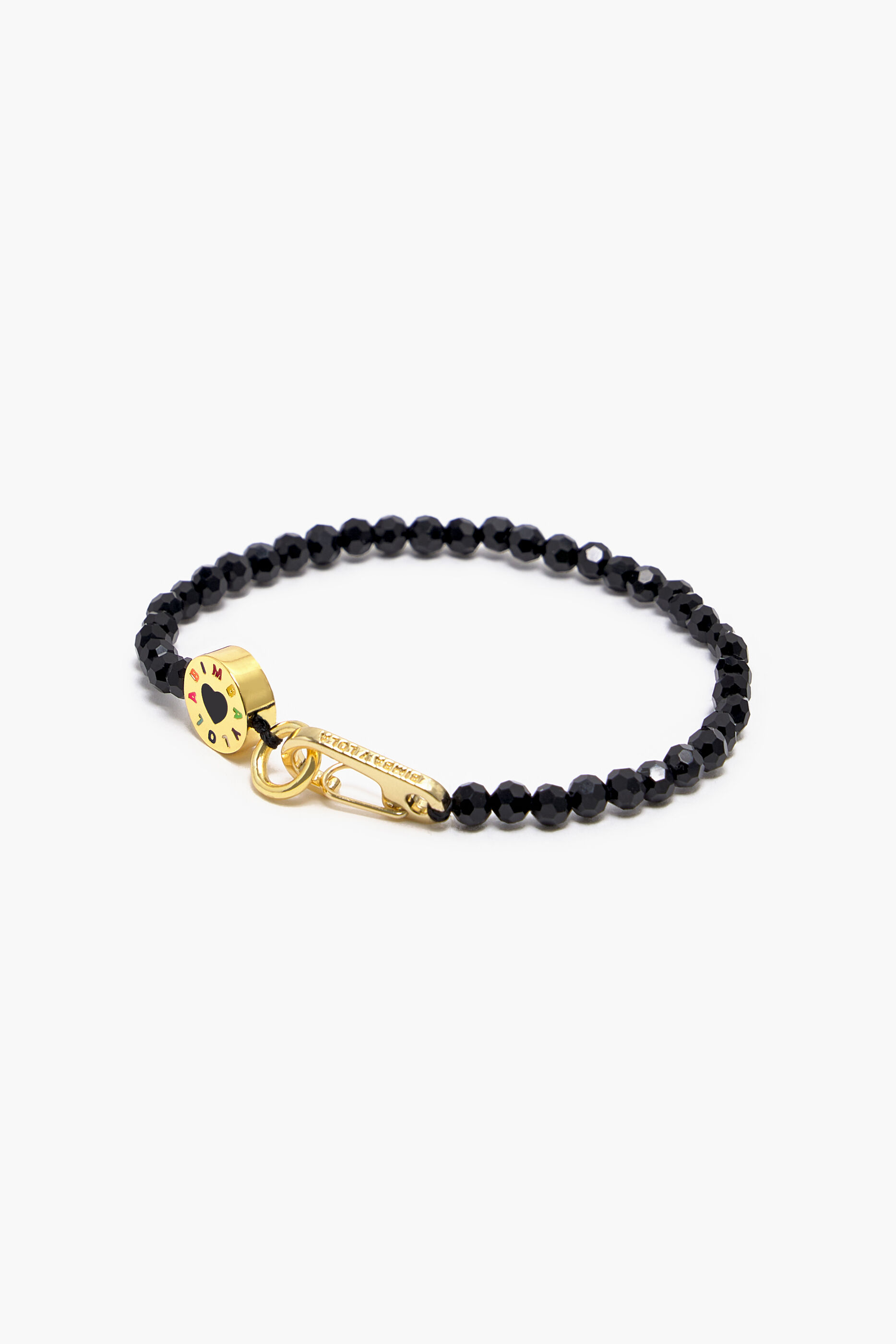 Pulseira fina com logotipo e cristais pretos.