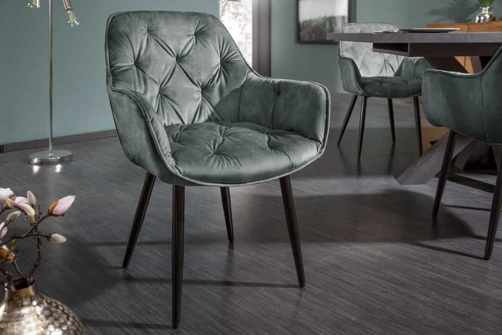 Design Stuhl MILANO grün Samt mit Armlehne Ziersteppung gepolstert schwarze Metallbeine