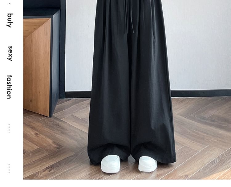 Tel tot 10 - Effen broek met wijde pijpen en trekkoord in de taille (verschillende ontwerpen)