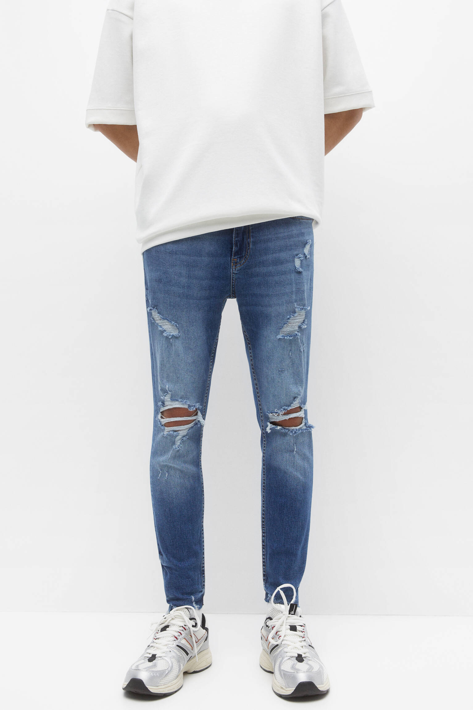 CALÇA JEANS SKINNY RASGADA - AZUL MÉDIO