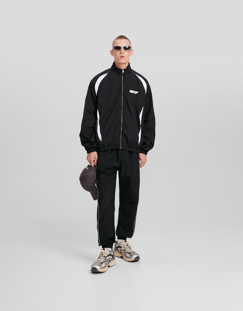 Calças de jogging técnicas com detalhes refletores