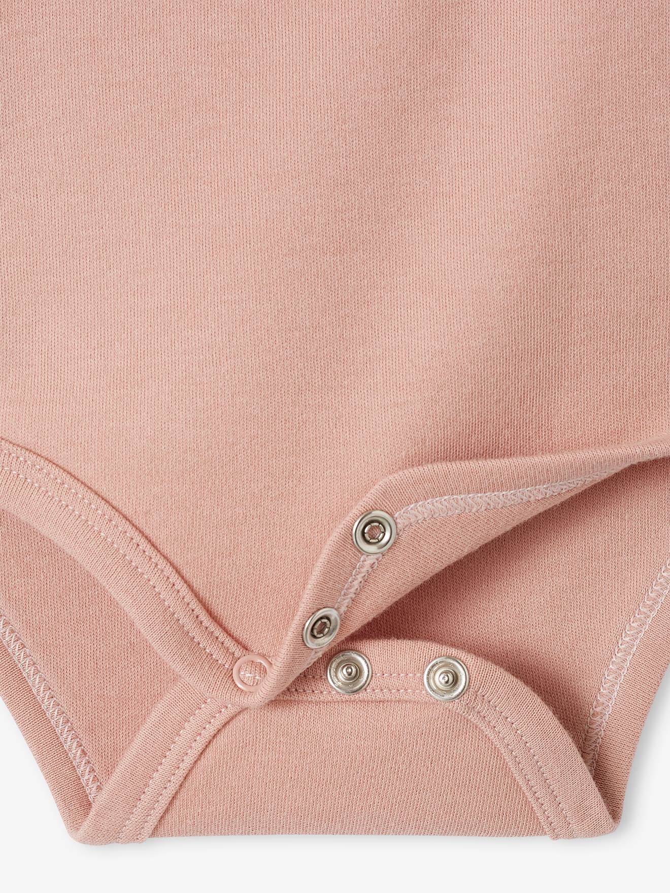 Conjunto de 3 bodies de manga comprida em algodão orgânico com abertura para recém-nascidos, cor rosa bebê com estampa de maquiagem.