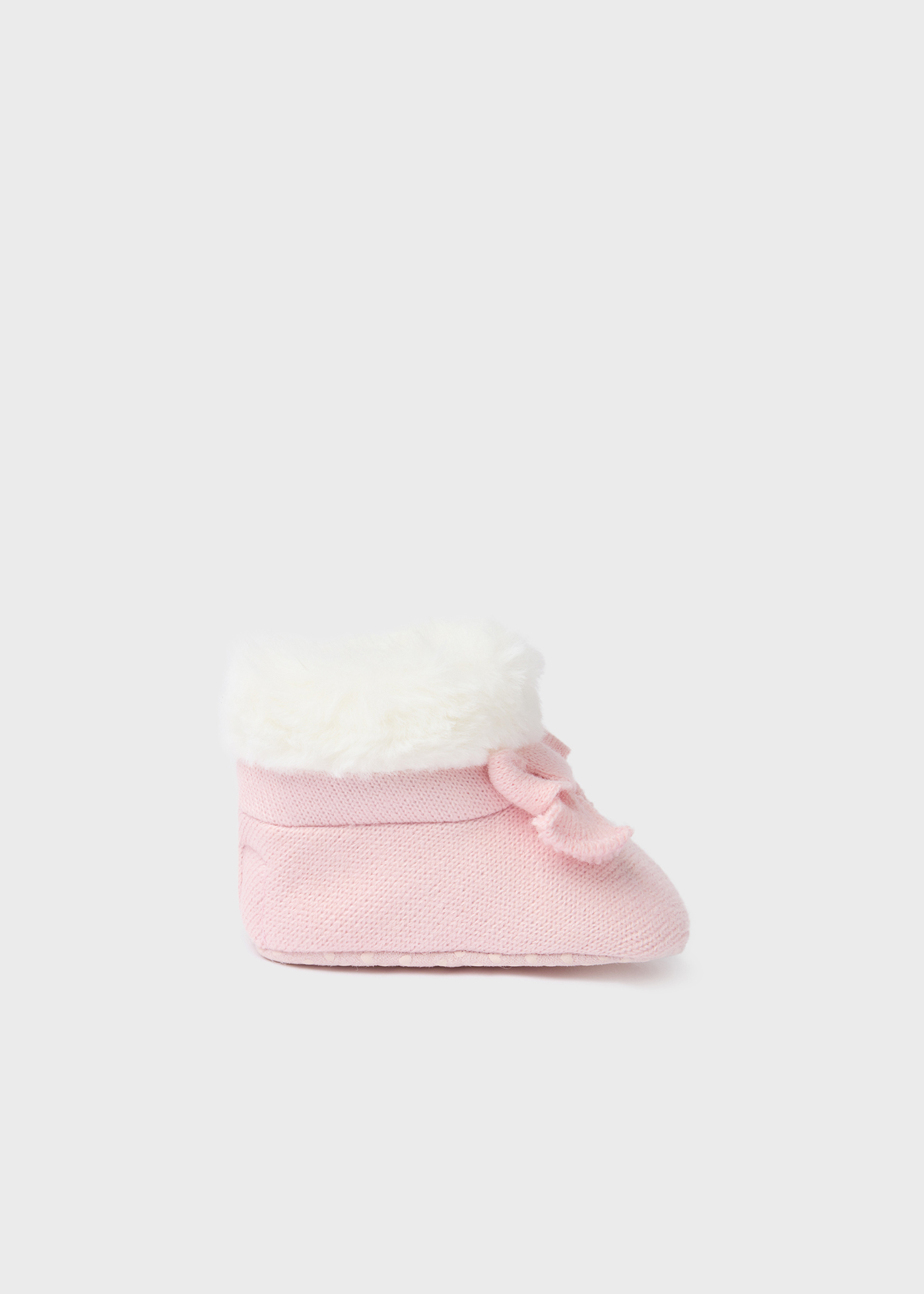 Bota de tricô com pelo de recém-nascido