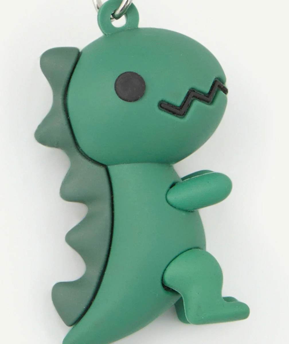 PORTE-CLÉS GARÇON COULEUR ARGENTÉE AVEC DINOSAURE VERT