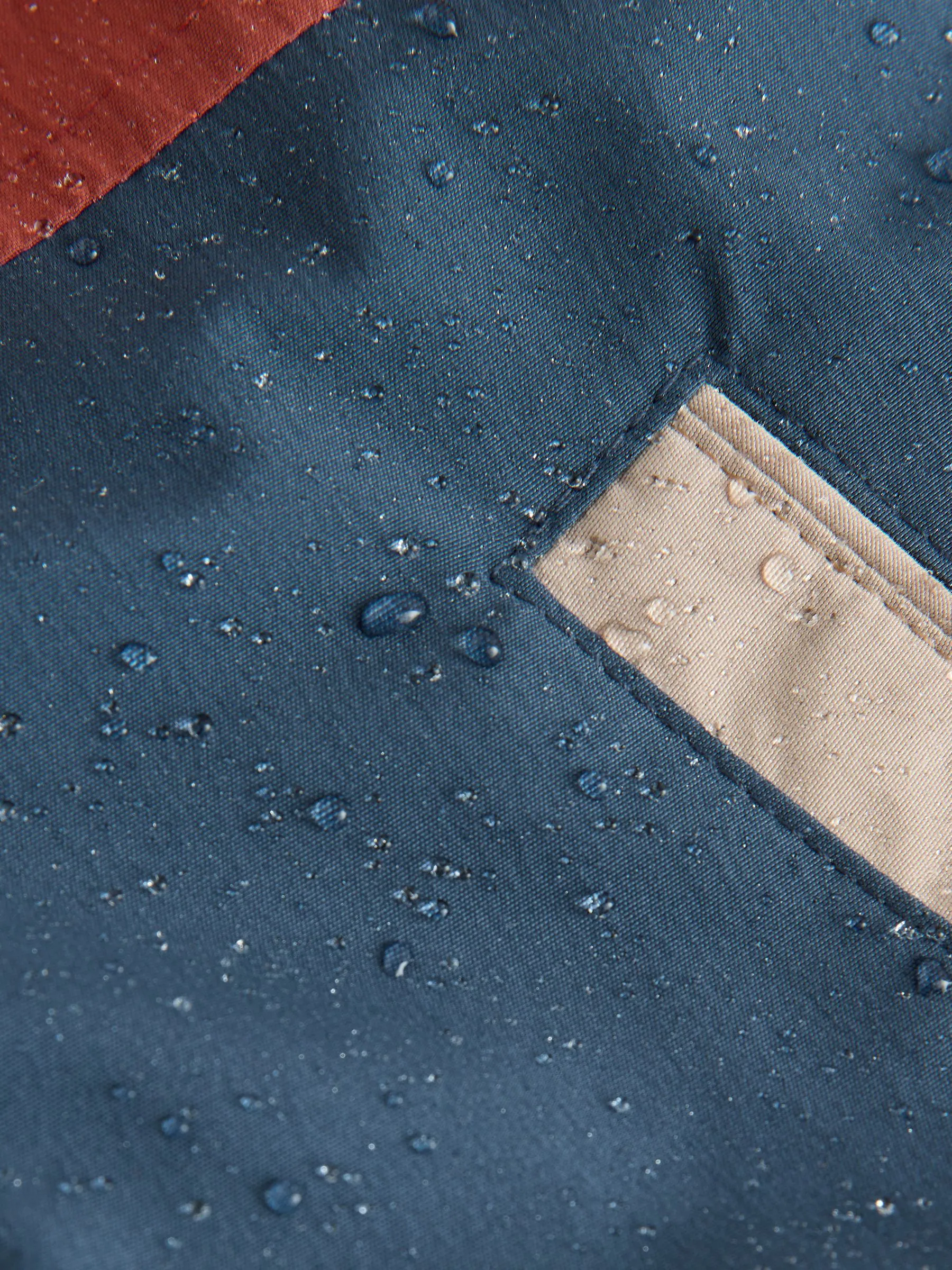Marineblauw/rood met kleurvlakken - Waterdichte parka met borgvoering (3mnd -7jr)