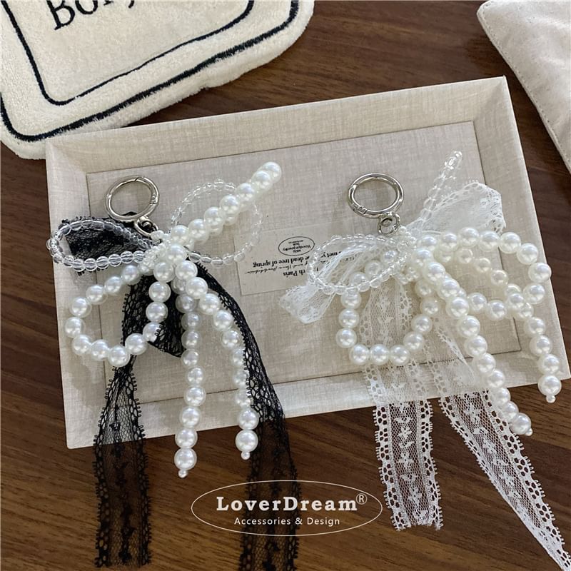 BeDaisy - Sleutelhanger met strik en imitatieparelkant