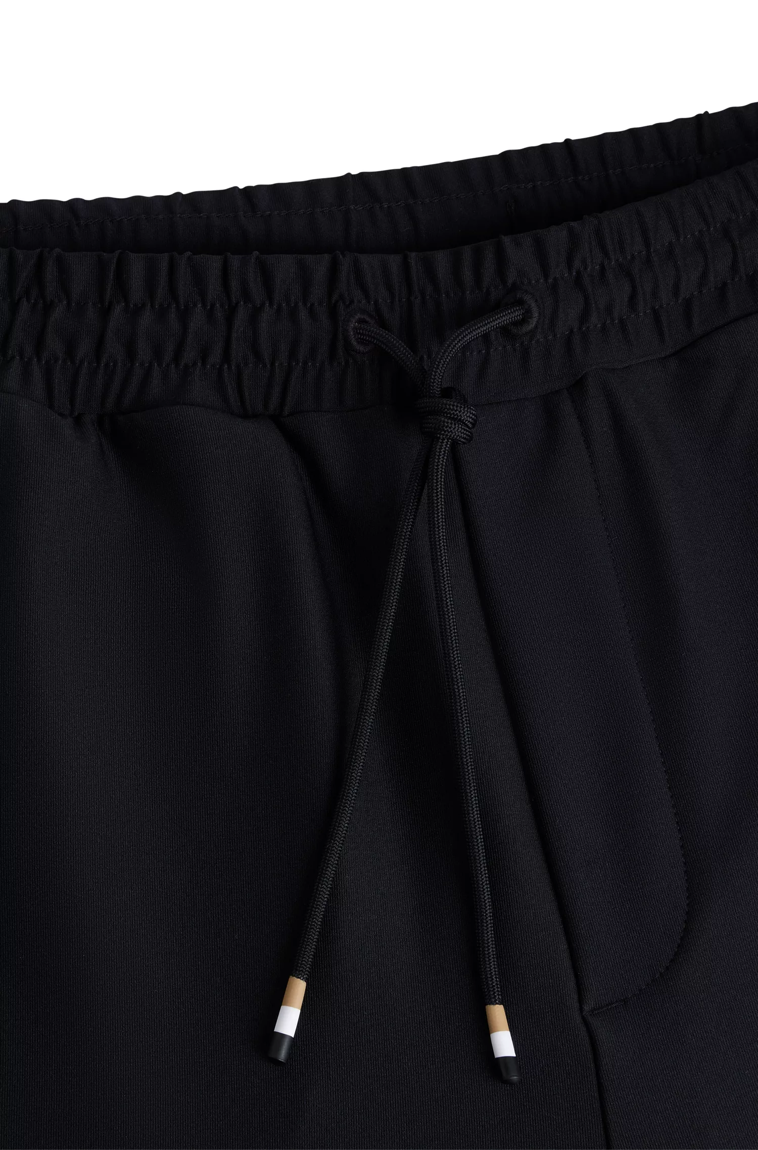 Calça de fato de treino BOSS em jersey elástico verde com fita listrada exclusiva.