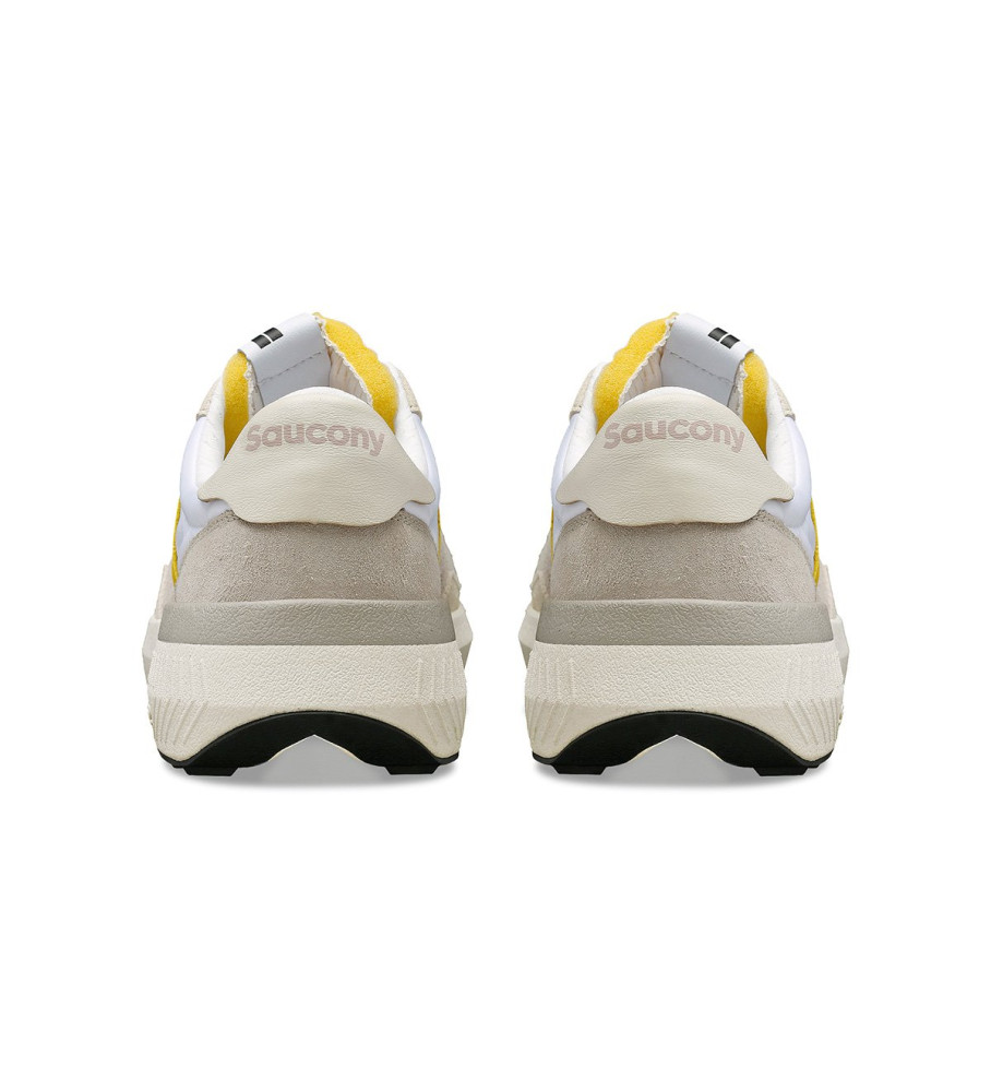 Tênis Saucony Jazz Nxt de couro, branco e amarelo.