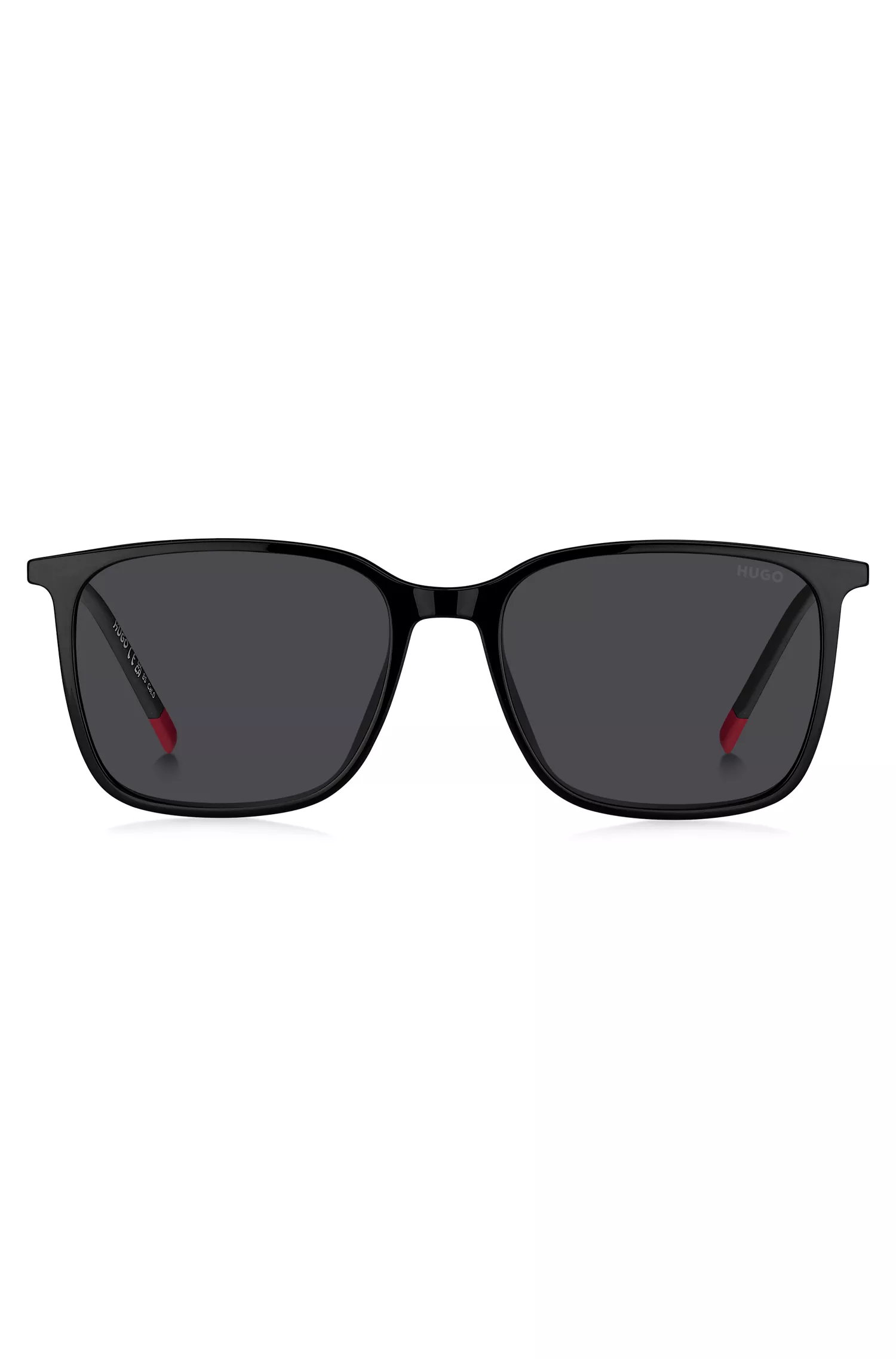 Armação de óculos HUGO vermelha e preta com lentes degradê de encaixe.