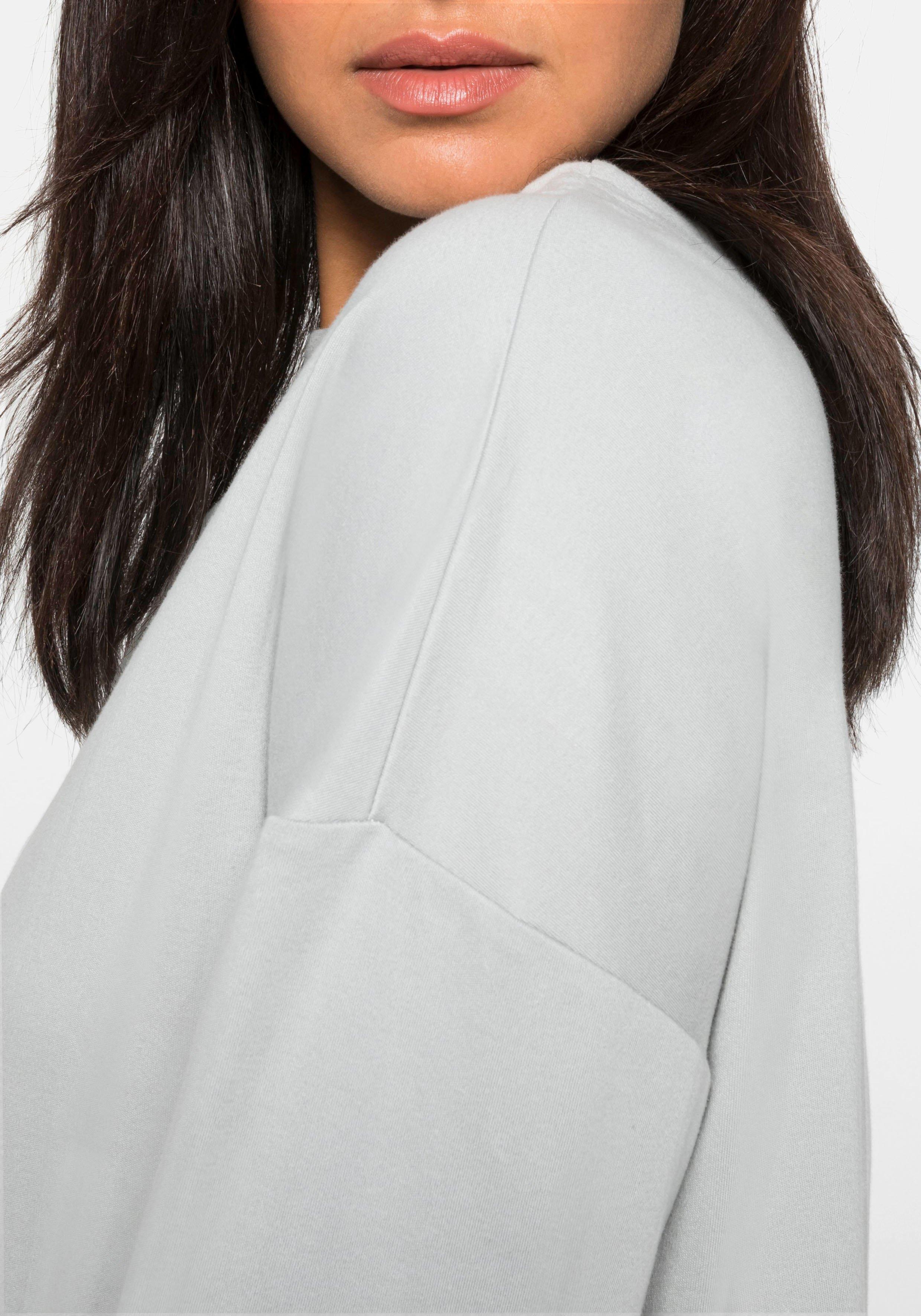 Langarmshirt mit Rippbund am Saum und Ziernähten