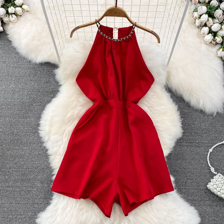 Yearnin - Mouwloze halter romper met wijde pijpen