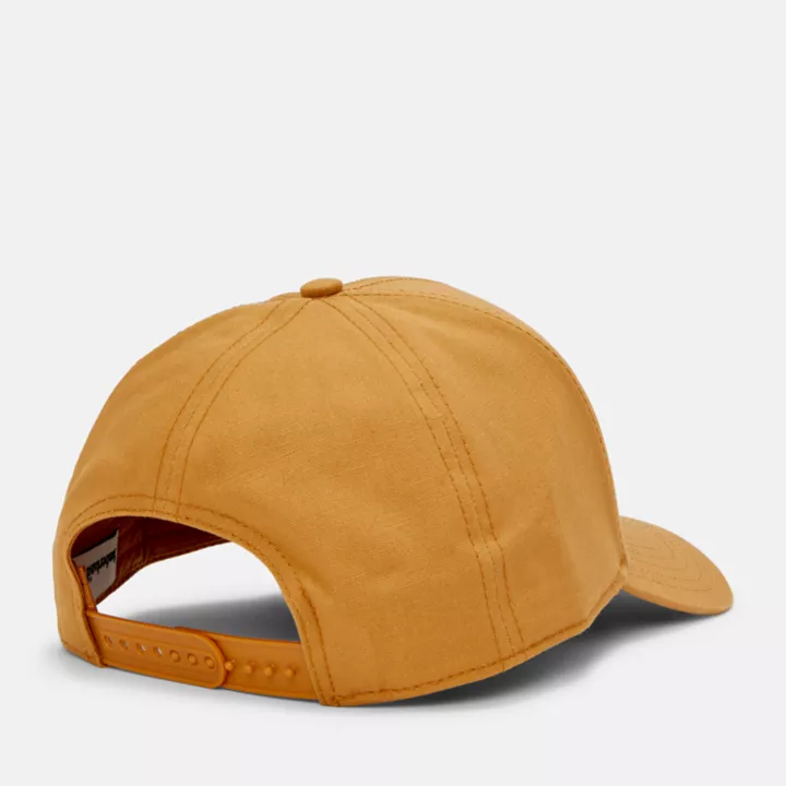Boné de beisebol unissex com patch de montanha na cor amarela.
