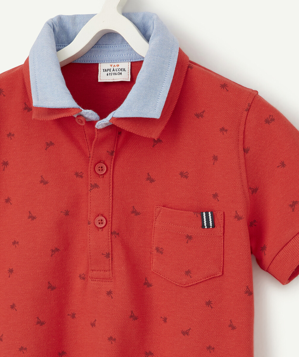 LE POLO ROUGE DOUBLE COL AVEC ANIMATION PALMIERS