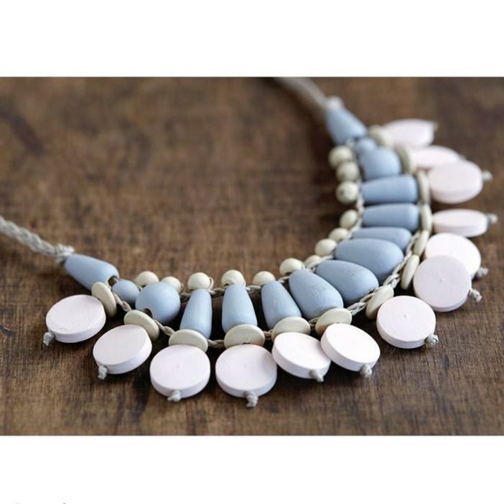 17 perles en bois rondes plates 15 x 4 mm