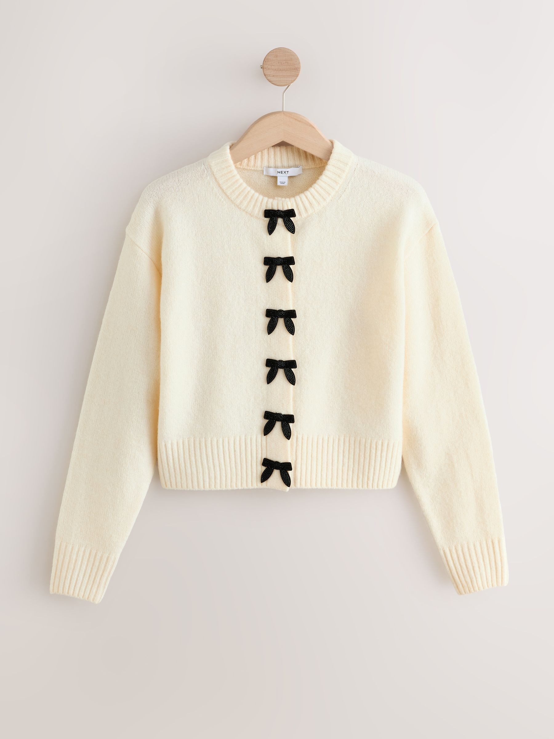 Ecru strikken - Gebreid vest met ronde hals