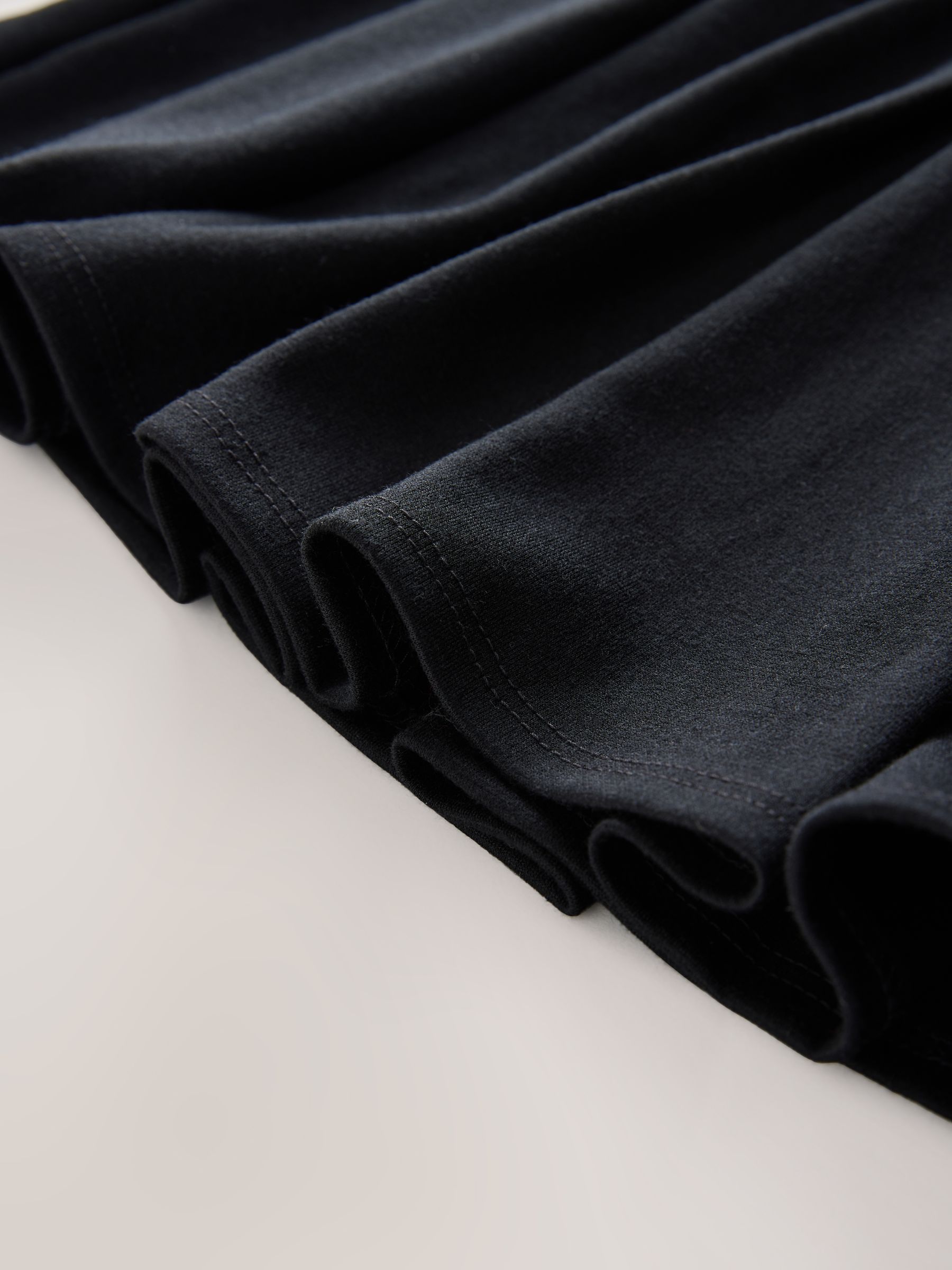 Zwart - Jersey pull-on geplooide schoolrok met stretch (3-17jr)