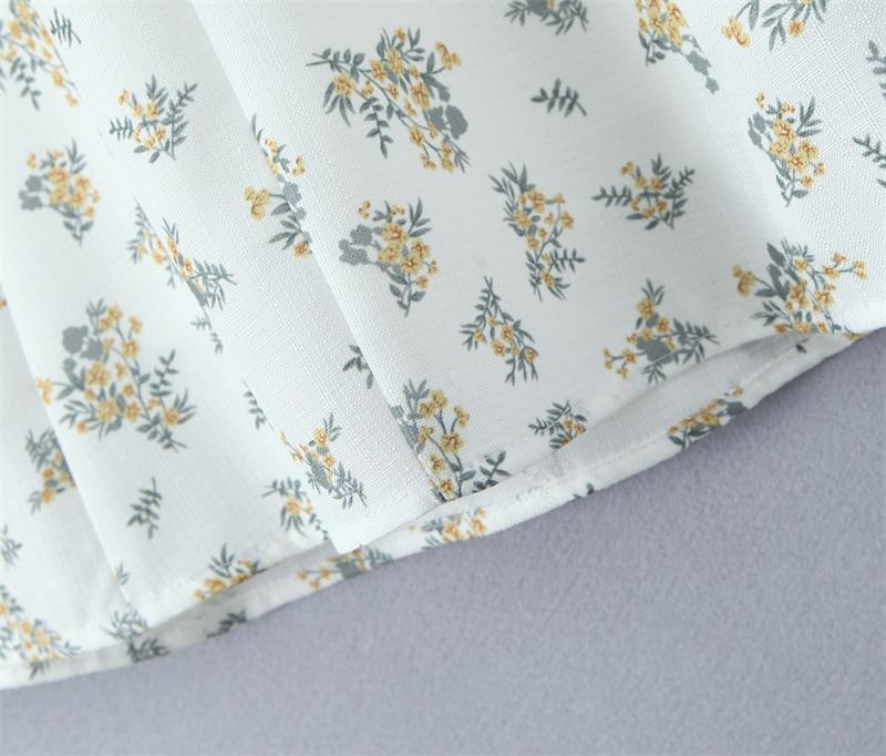 Avauntgardo - Halter V-hals bloemenprint kanten rand open rug mini A-lijn jurk