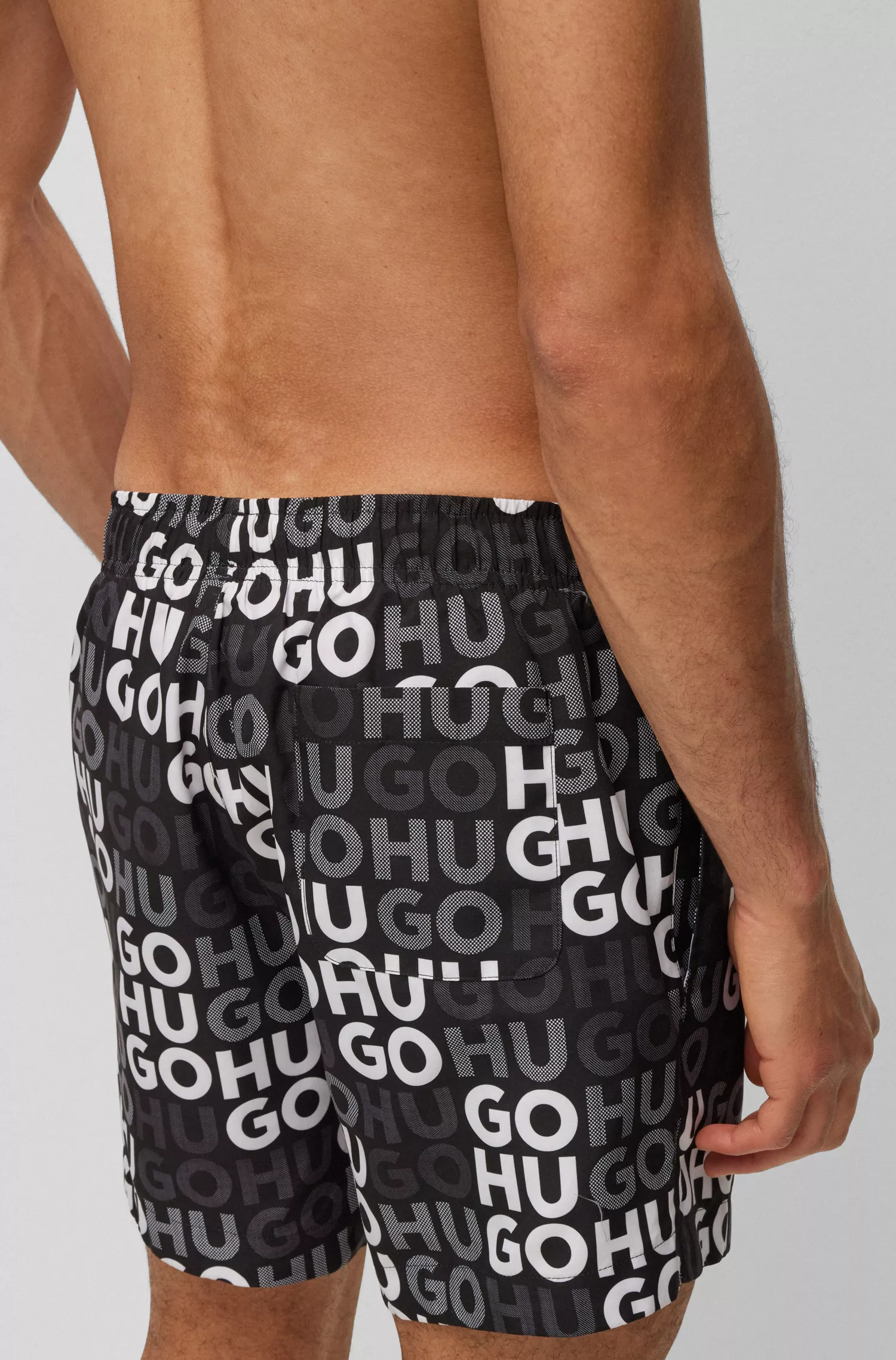 Calções de banho HUGO vermelhos com estampa do logotipo por toda a peça.