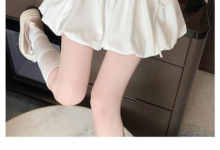 Yohana - Mini A-lijn rok met elastische taille en strik en bubbelzoom