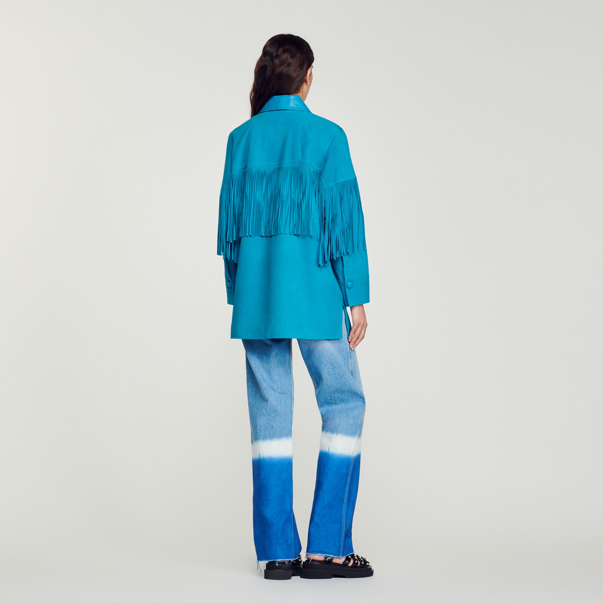 Veste longue en cuir á franges