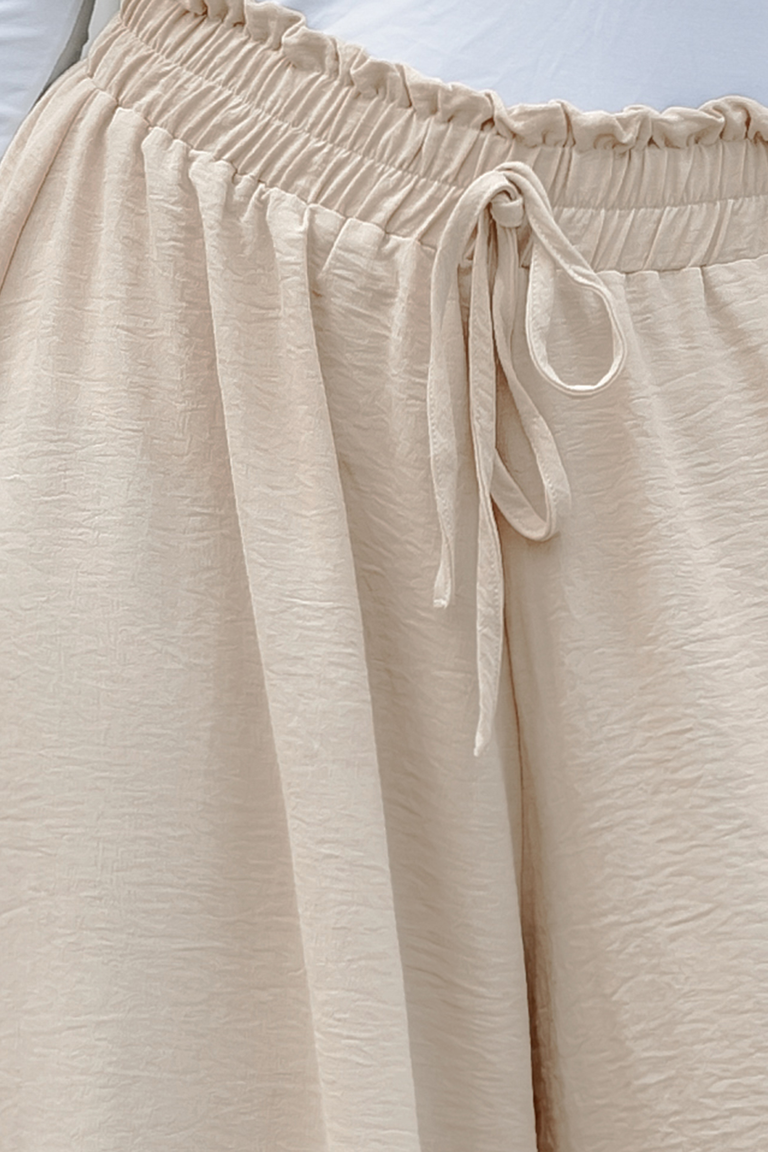 Pantalon taille froncée abricot à cordon