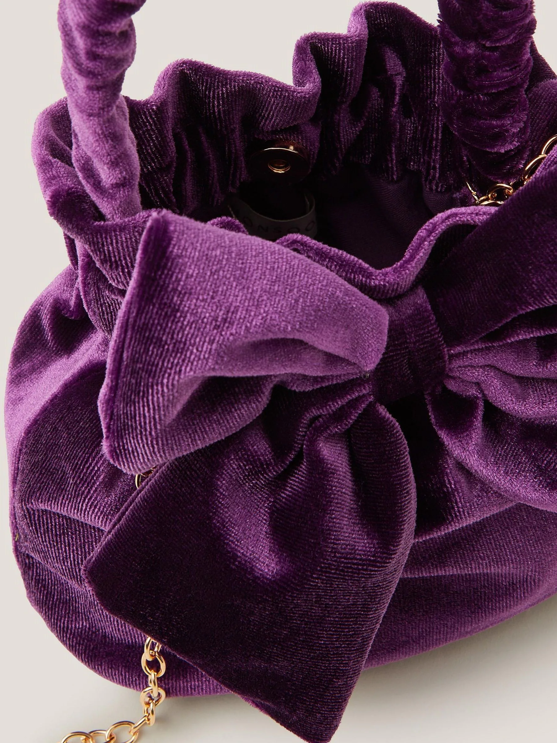 Monsoon Bow Velvet Pouch Bag