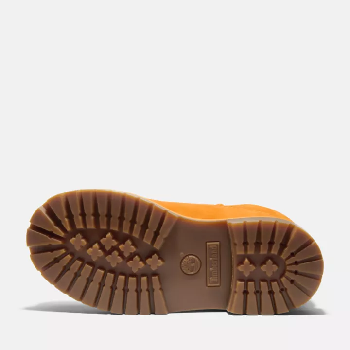 Bota Timberland Premium de 6 polegadas impermeável, edição 50, para jovens, na cor laranja.