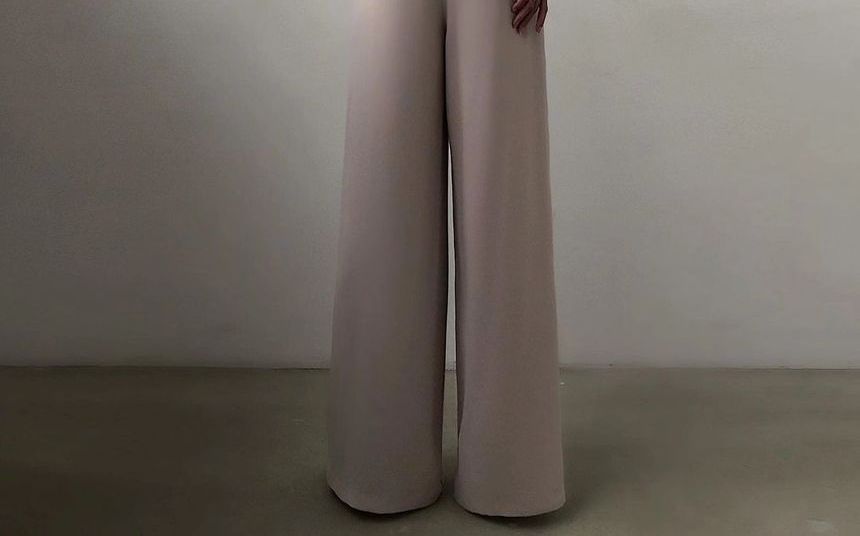 Sensarra - Spaghettibandjes jumpsuit met wijde pijpen