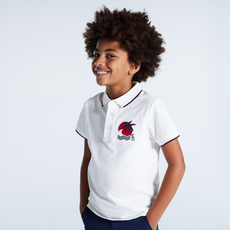 Polo en jersey piqué motif palmier blanc garçon
