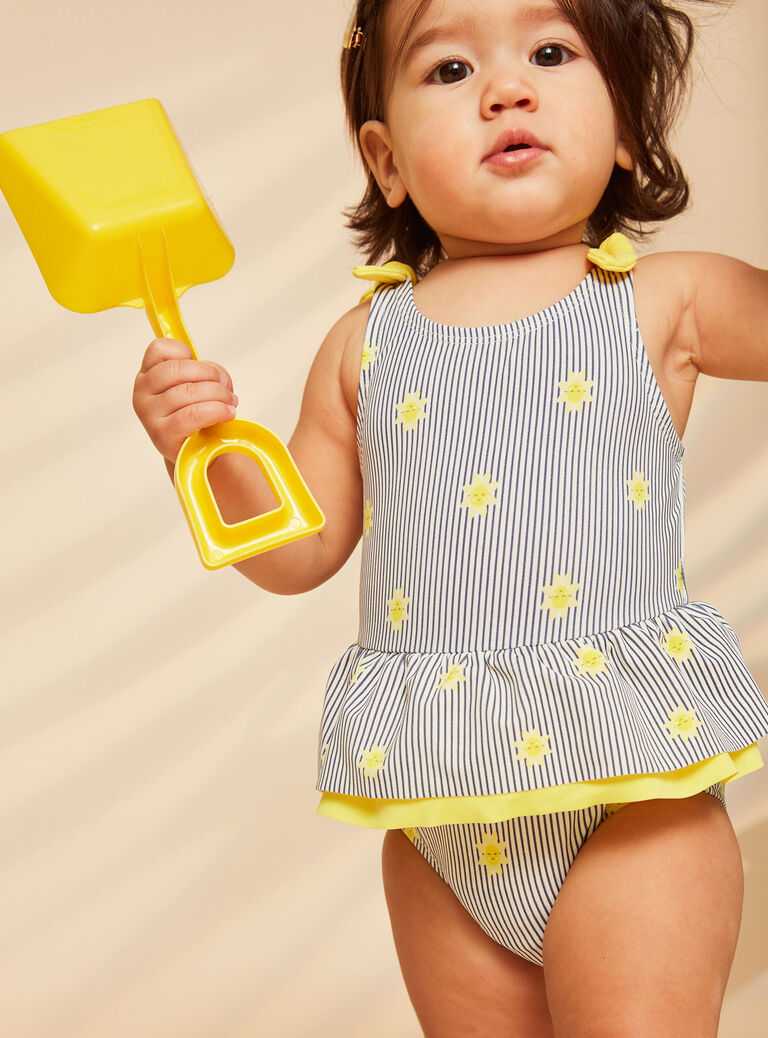Maillot de bain 1 pièce bleu marine et jaune à imprimé à rayures et soleils