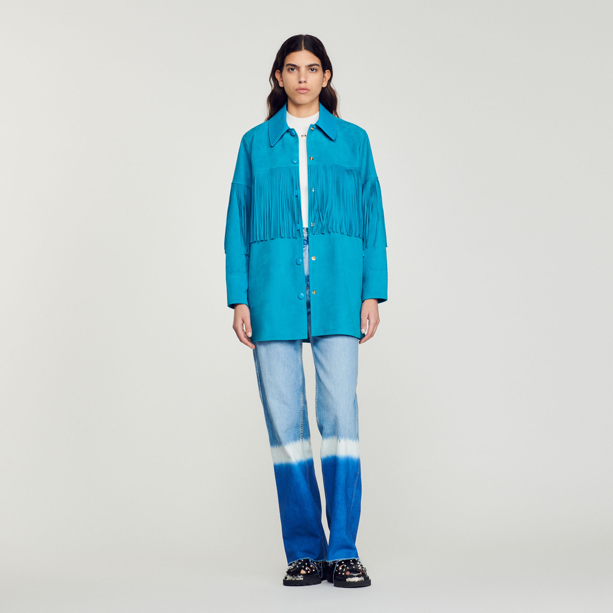 Veste longue en cuir á franges
