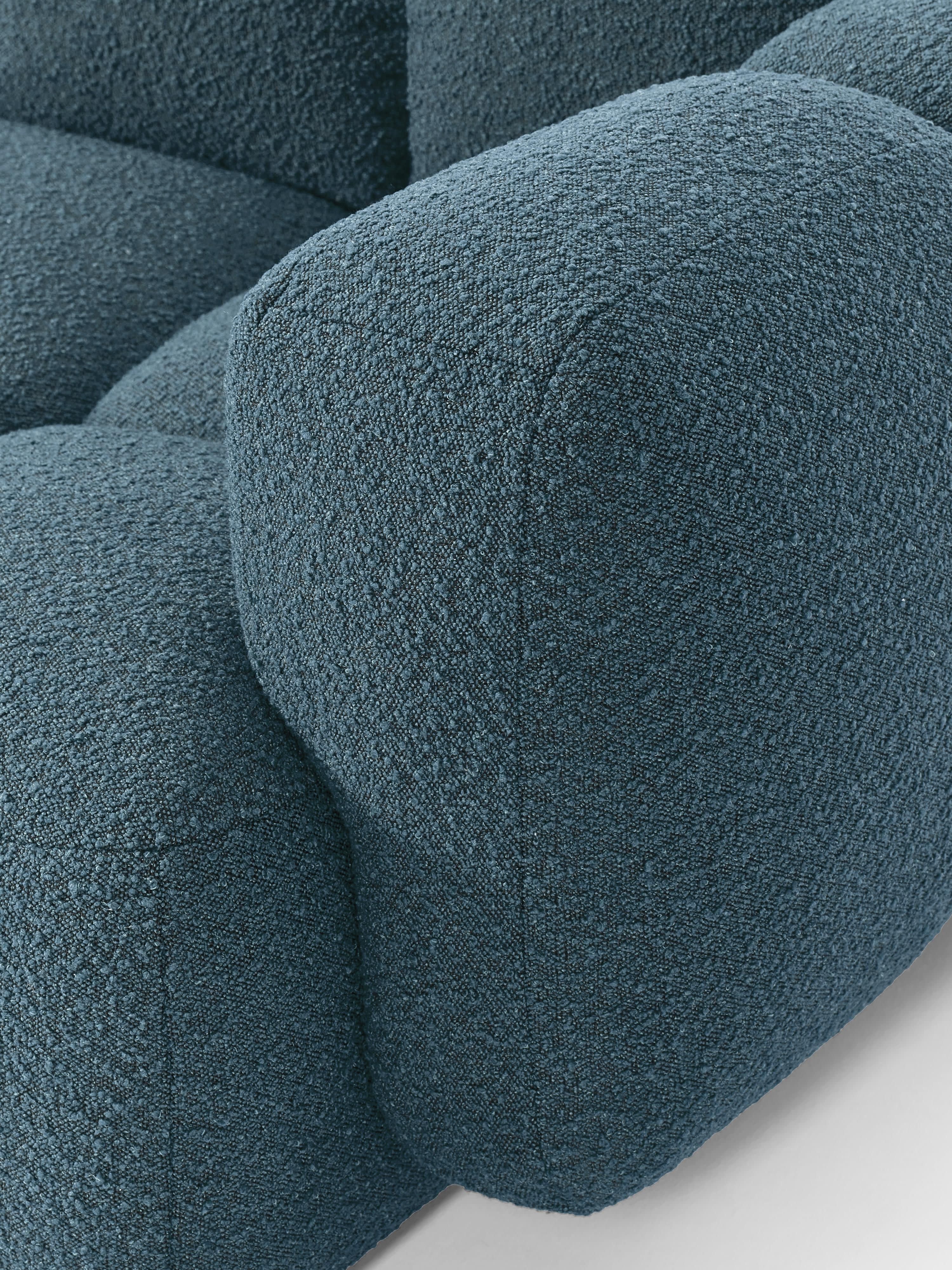 Modulaire bank Tayla (4-zits) van bouclé met poef (links/rechts)