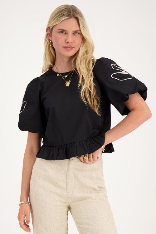 Zwarte blouse met bloemen detail en strikjes aan achterzijde
