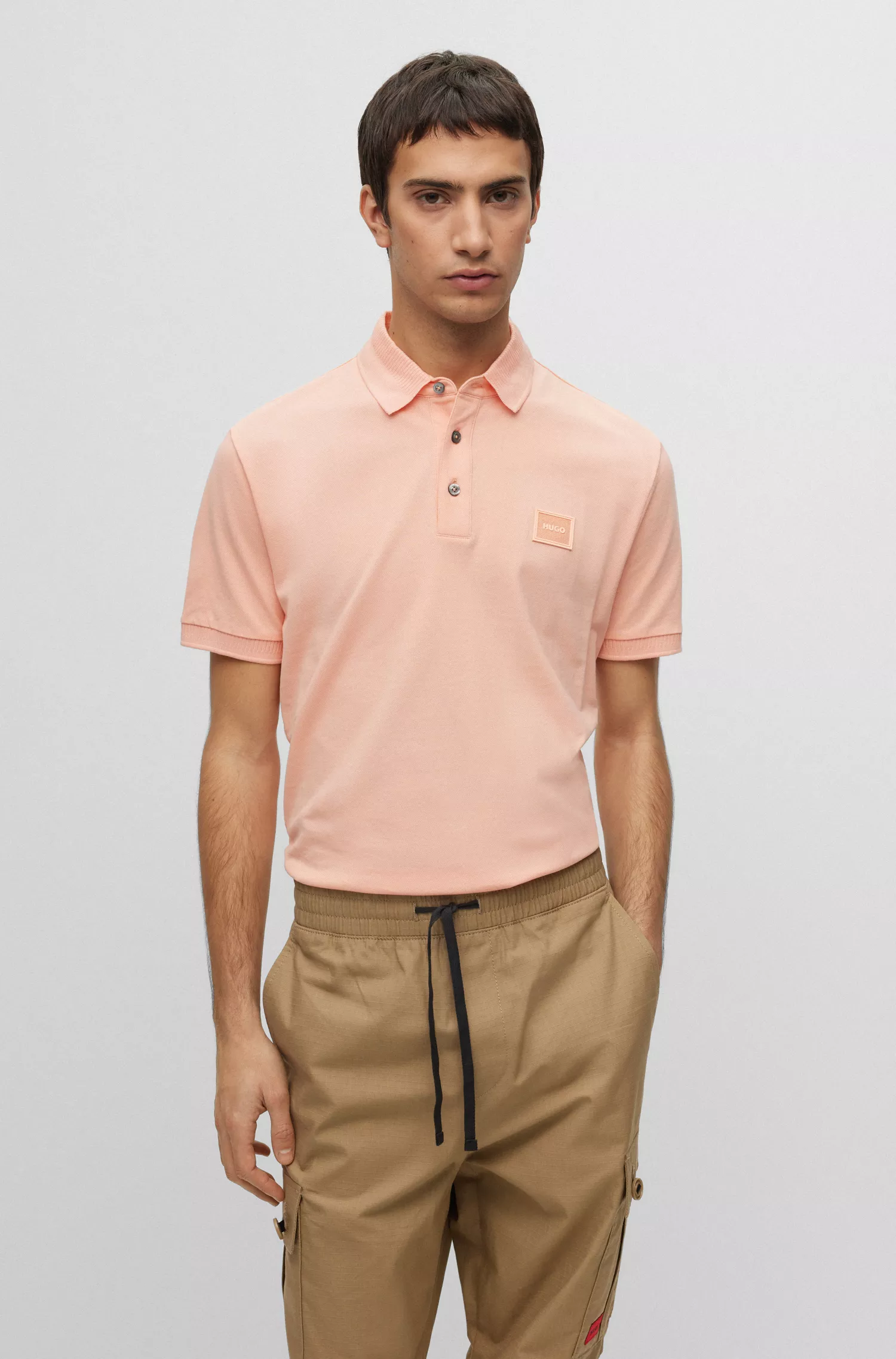 Camisa polo HUGO vermelha em piqué de algodão com corte slim e emblema com o logotipo.